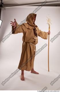 16 2019 01 JOEL ADAMSON MONK STANDING POSE WITH A…